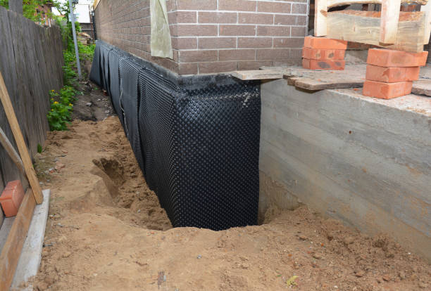 SJ Waterproofing Pros technician performing targeted Exterior Waterproofing assessment in Northfield, OH